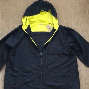 NWT reebok light windbreaker. Hood zipper pockets.
